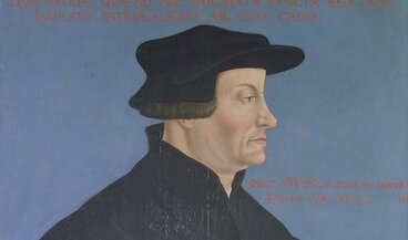 Gemaltes Porträt des Reformators Huldrych Zwingli.
