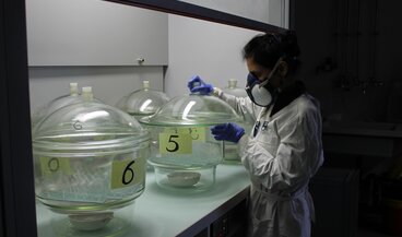 Mrs. Sharma preparing the aging set up of the artificial corrosion experiment of model glass